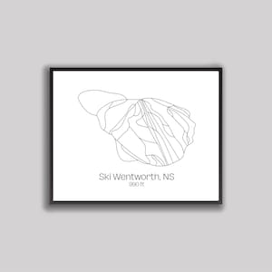 May include: Black framed print featuring a minimalist line drawing of a mountain ski resort map. The text "Ski Wentworth, NS" is below the map, with "990 ft" beneath it. The artwork is set against a white background.