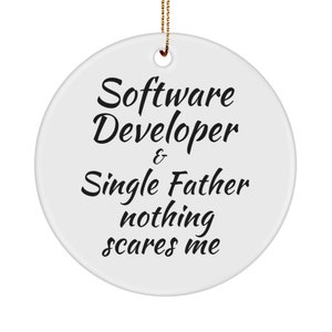 May include: White ceramic Christmas ornament with black text that reads "Software Developer & Single Father nothing scares me".