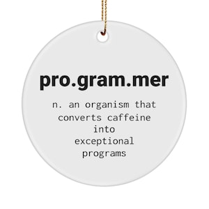 May include: White ceramic ornament with the word "pro.gram.mer" in black text. The text below defines a programmer as an organism that converts caffeine into exceptional programs.