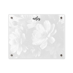 May include: White acrylic dry erase board with a floral design and the word "notes" printed in black.