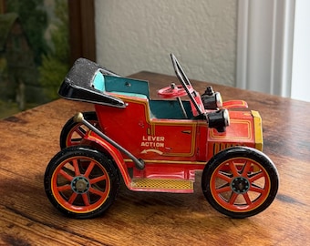 Coche de hojalata Masudaya Modern Toys – Mecanismo de palanca – Litografía japonesa sobre hojalata – Patente n.º 27579