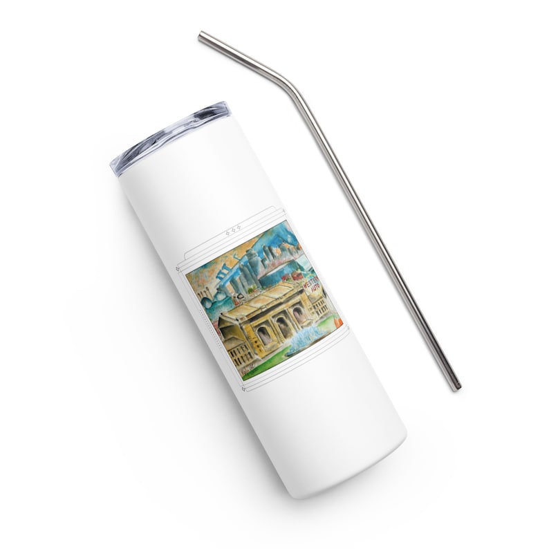 May include: White stainless steel tumbler with a colorful illustration of a building and cityscape. The tumbler has a lid and comes with a matching stainless steel straw.