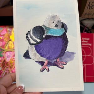 May include: Watercolour painting of a plump pigeon. The bird has a grey head, a turquoise neck, and a purple body. Its wings are black and white, and its feet are pink. The background is a light blue wash.