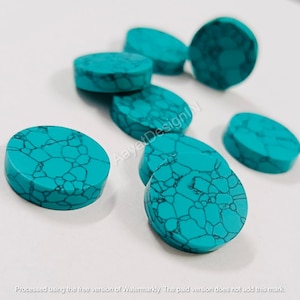 May include: A collection of eight turquoise cabochons, each with a unique marbled pattern. The cabochons are round and have a smooth, polished surface.