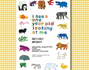 May include: A colorful invitation for a first birthday party with the text "i see a one year old looking at me" and the text "ERIC'S FIRST BIRTHDAY!"  The invitation features a variety of animals, including a lion, a zebra, a hippopotamus, a bear, a flamingo, a peacock, a snake, a frog, and a duck.