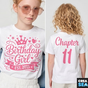 May include: White t-shirt with pink text. The front says "Birthday Girl EST. 2015" with a crown and hearts. The back says "Chapter 11". The shirt is for a birthday celebration.