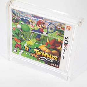 May include: A clear plastic case containing a Nintendo 3DS game cartridge. The game is Mario Tennis Open and features Mario, Luigi, and Yoshi playing tennis on a green court. The game is rated A by the CERO rating system.