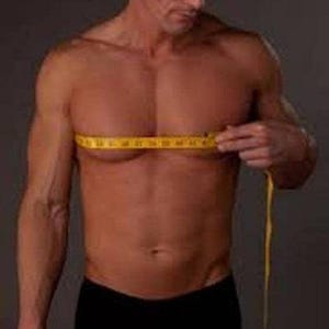 May include: A man is measuring his chest with a yellow tape measure. He is wearing black underwear.