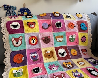 May include: A colorful crochet blanket featuring squares with various animal faces, including a fox, bear, and sheep. The blanket has a cream-colored, scalloped edge and is displayed on a gray couch. The squares are in a variety of pastel colors.