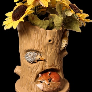 May include: A set of three ceramic mugs with a speckled, matte finish. The mugs are in shades of cream, light gray, and dark gray. Each mug has a simple, minimalist design, perfect for coffee or tea.