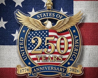 May include: A pendant with the text "250 YEARS" and "1776 ANNIVERSARY 2026" against a backdrop of the American flag. The pendant features an eagle with outstretched wings and the words "UNITED STATES OF AMERICA".