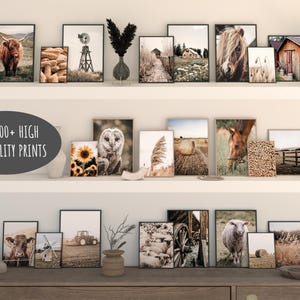 May include: A collection of framed prints featuring various farm and nature scenes, including a barn, a field of hay bales, a cow, a horse, a barn owl, and a flock of sheep. The prints are arranged on a shelf with a text overlay that reads "1200+ HIGH QUALITY PRINTS".