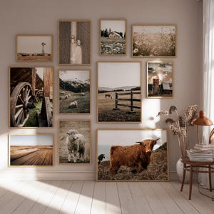 May include: A gallery wall with framed prints of various landscapes and animals. The prints feature a variety of colors, including brown, white, and green. The prints are arranged in a grid pattern on a light beige wall.