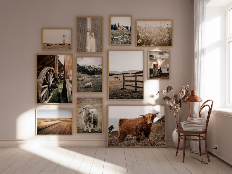 May include: A gallery wall with framed prints of various landscapes and animals. The prints feature a variety of colors, including brown, white, and green. The prints are arranged in a grid pattern on a light beige wall.