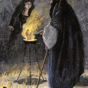 May include: A man in a dark robe and a woman in a black dress stand in a dimly lit room. The man holds a staff with a star at the top and a knife in his other hand. He is holding a hand over a small fire. The woman is looking at the fire. There is a book on the floor with a red ribbon.