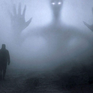 May include: A shadowy figure with glowing eyes stands in a foggy forest, a lone person walks towards it.