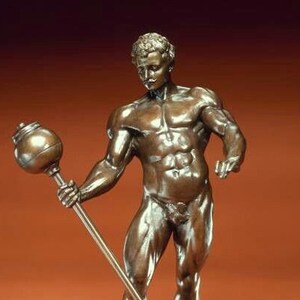 May include: A bronze sculpture of a muscular figure holding a club. The figure is nude and has a strong, athletic build. The sculpture is detailed and realistic.