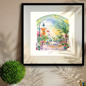 May include: Watercolor painting of a street scene in Delray Beach, Florida. The street is lined with palm trees and colorful buildings. The sign above the street reads "Pineapple Grove".