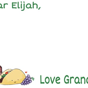 May include: A handwritten note card with green text that reads "Dear Elijah, Love Grandma". The card has a cartoon illustration of a carton of milk, a taco, and a bunch of grapes.
