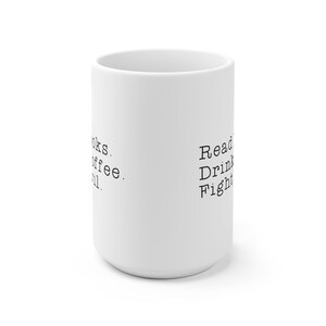 May include: White ceramic mug with black text that reads "Read. Drink. Fight." on one side and "Books. Coffee. Chill." on the other side.