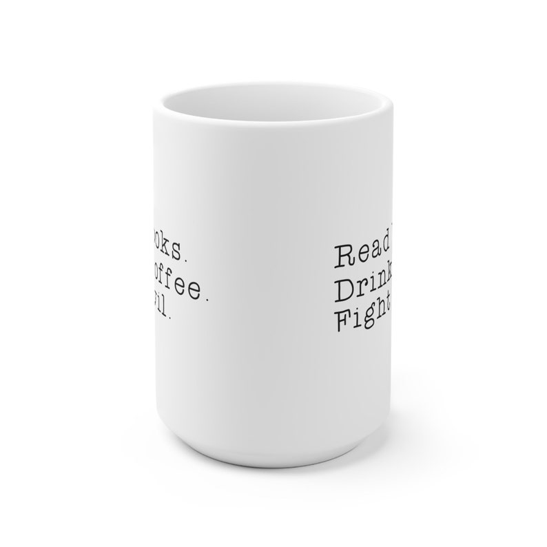 May include: White ceramic mug with black text that reads "Read. Drink. Fight." on one side and "Books. Coffee. Chill." on the other side.