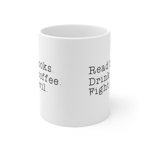 May include: White ceramic mug with black text that reads "Read Books. Drink Coffee. Fight Evil."