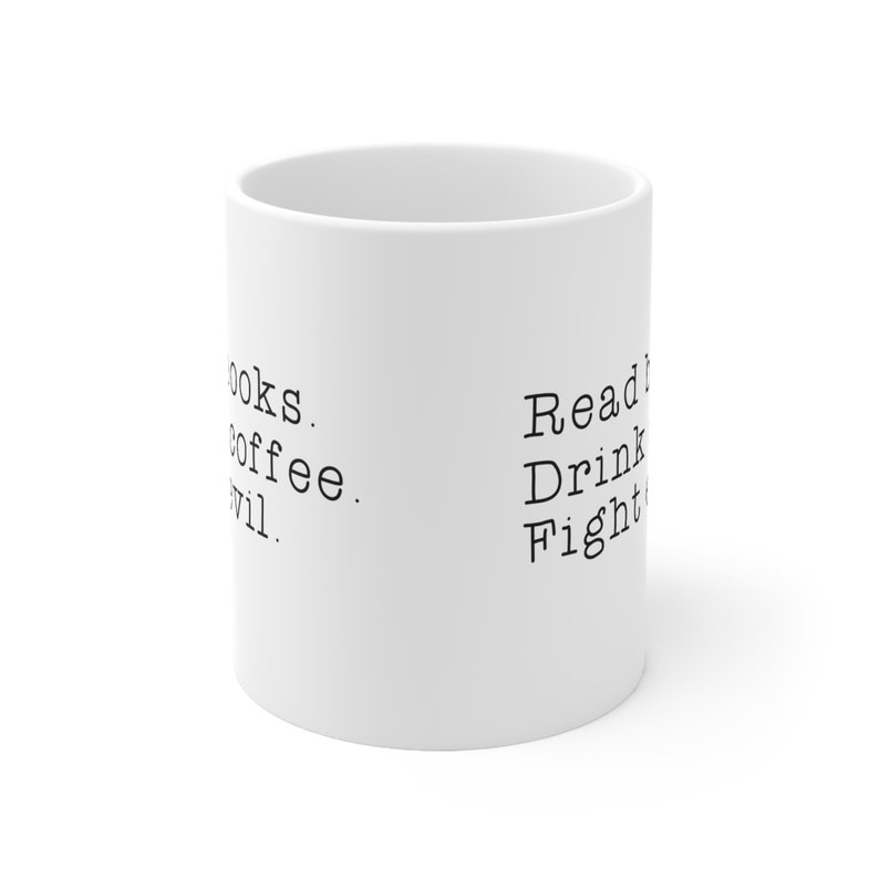 May include: White ceramic mug with black text that reads "Read Books. Drink Coffee. Fight Evil."