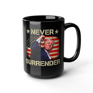 May include: Black coffee mug with a white and red American flag design and the text "NEVER SURRENDER" in white. A man with a white and red American flag in the background is raising his fist in the air.
