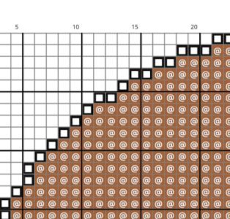May include: A cross-stitch pattern chart with a grid of squares. The design features a brown, diagonal section filled with "@" symbols, and a white border. The numbers 5, 10, 15, and 20 are visible along the top.