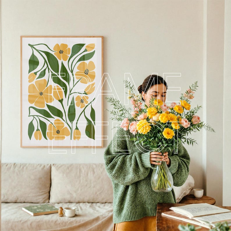Realistic Art Mockup with Woman in Neutral Living Room – A photorealistic framed art mockup scene shows a woman arranging flowers beside a linen-covered sofa. A large wooden poster mockup with a subtle green frame adds depth to the modern setting, with natural light and a minimal table setup enhancing the calm, curated design.