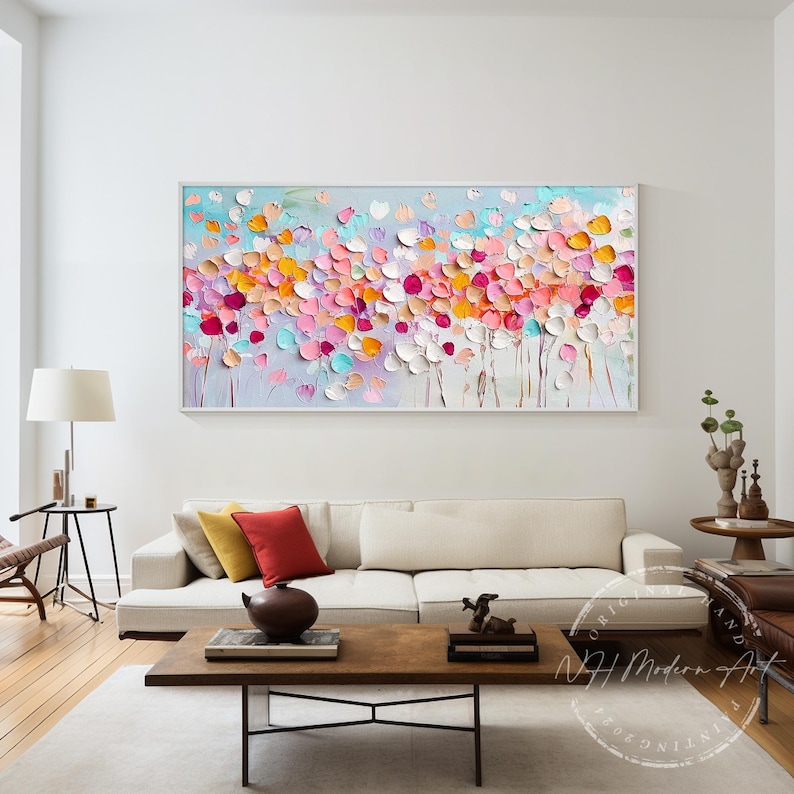 May include: Abstract painting with a textured, colorful floral design. The painting features a variety of pink, orange, yellow, and blue colors. The background is a light blue color.