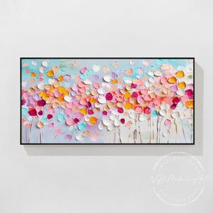 May include: Abstract painting of a field of colorful flowers in shades of pink, orange, yellow, blue, and white. The flowers are painted in a textured style, giving the painting a three-dimensional effect.