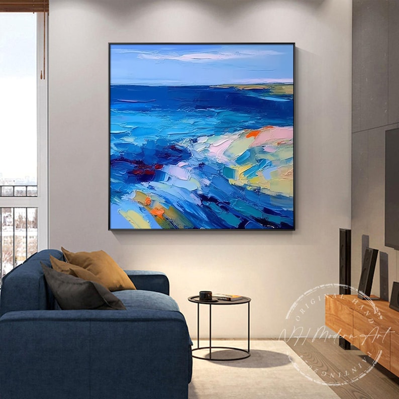 May include: Abstract painting of a seascape with blue, green, yellow, and pink hues. The painting depicts a horizon with waves crashing on the shore.