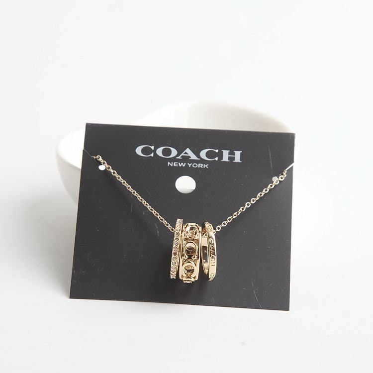 Coach bag deals charms uk
