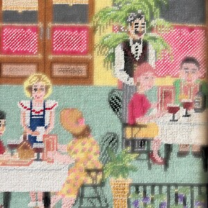 May include: Needlepoint artwork depicting a restaurant scene. The image shows people seated at tables, with a waiter in the background. The color palette includes pink, yellow, and green, with a textured appearance. The artwork has a vintage aesthetic.