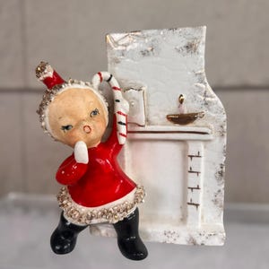 Vintage RARE 1950s 1960s UCAGCO Christmas Planter – Japan Ceramic Girl with Candy Cane by Fireplace, Spaghetti Trim Holiday Decor