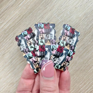 May include: Three colourful fabric patches with a repeating pattern of black and white images of women's faces. The patches have a scalloped edge and are arranged in a triangle shape.