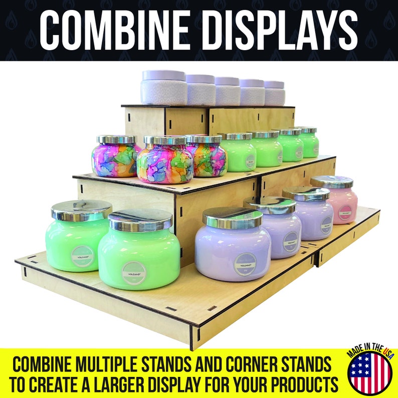 May include: A tiered wooden display stand showcasing various scented candles in glass jars with silver lids. The candles are in shades of green, purple, pink, and colorful tie-dye patterns. The text "COMBINE DISPLAYS" is at the top.