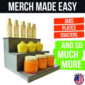 May include: A wooden display stand holds various merchandise. The top shelf features six gold spray bottles with citrus labels. The middle shelf displays yellow vases, and the bottom shelf showcases jars filled with orange contents. Text reads "MERCH MADE EASY."