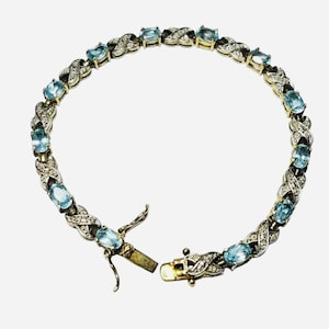 Sterling Silver Swiss Blue Topaz 14 Stone Tennis Bracelet Open Criss Cross X