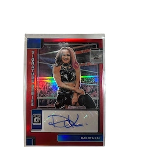 2023 Panini Chronicles WWE Dakota Kai Optic Signature Series Red Auto #DO-DAK sp