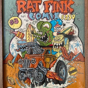 May include: A vintage comic book cover featuring Rat Fink, a cartoon character with a hot rod car. The cover is orange, green, and blue with the text "Rat Fink Comics #3 $2.50".