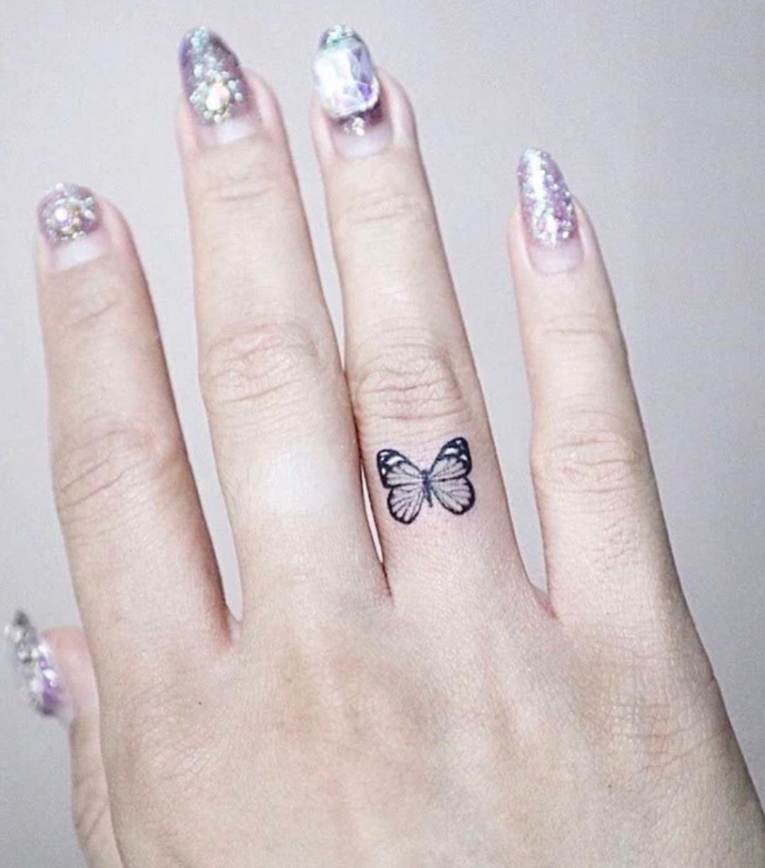 Butterfly Tattoo on Hand: A Symbol of Beauty & Balance