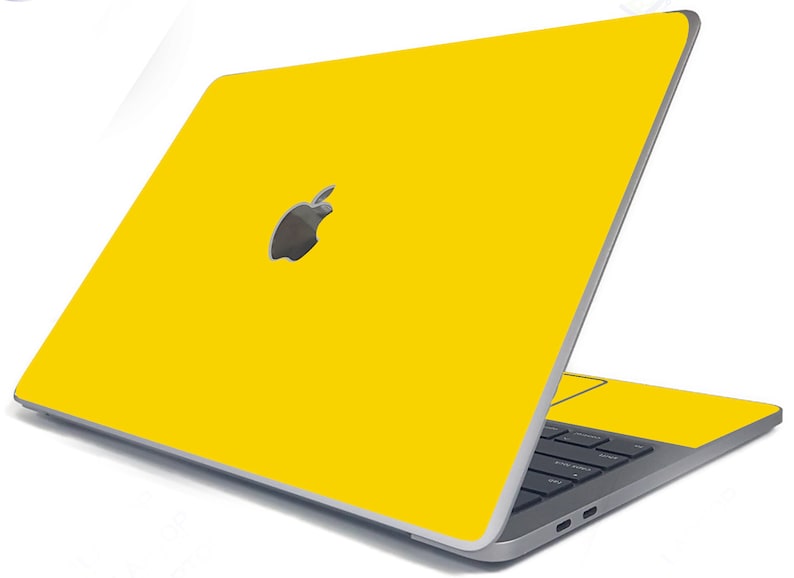 May include: A yellow laptop with an Apple logo on the lid. The laptop is closed and the screen is facing away from the viewer.