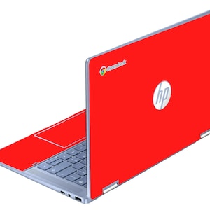 May include: A red HP Chromebook laptop with a silver frame. The laptop is open, displaying the keyboard and touchpad. The HP logo is visible on the lid, and the Chromebook logo is in the top left corner.