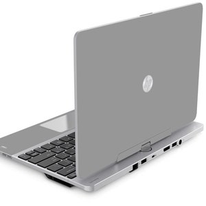 May include: A silver HP laptop with the lid closed. The laptop is sitting on a white surface.