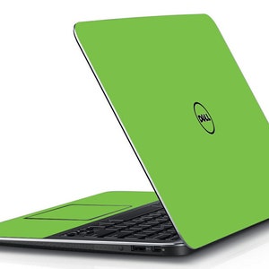May include: A green laptop computer with a Dell logo on the lid. The laptop is closed and the lid is open at a slight angle.