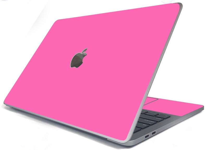 May include: A pink laptop computer with a silver Apple logo on the lid. The laptop is closed and the screen is facing away from the viewer.