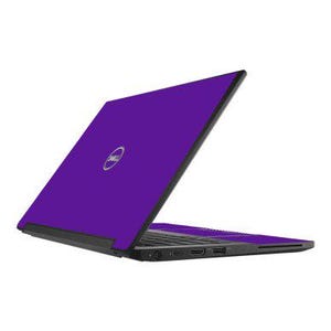 May include: A purple Dell laptop with a silver logo on the lid. The laptop is open, revealing the keyboard and ports on the side. The background is plain white.