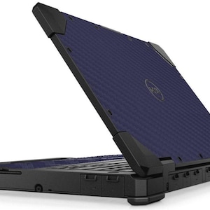 May include: A black Dell laptop with a blue carbon fiber design on the lid. The laptop is closed and the lid is open at a 45-degree angle.
